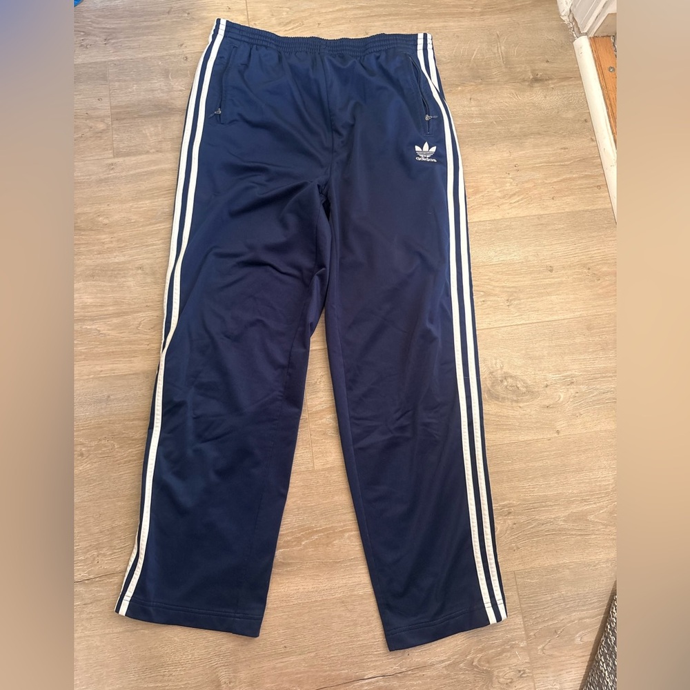 Adidas  Blue track pants with White Stripes medium